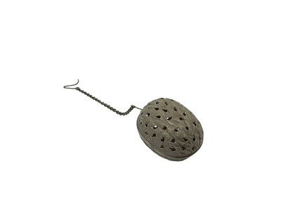 Lot 263 - Victorian silver walnut-shaped pomander with chain