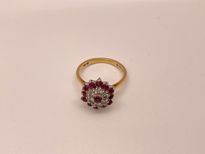 Lot 28 - Ruby and diamond cluster ring with a cluster of brilliant cut diamonds and mixed cut rubies in tiered claw setting on 18ct gold shank