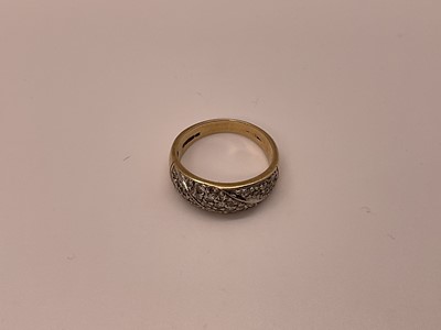 Lot 30 - 9ct gold ring with a band of pavé set diamonds