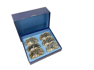Lot 143 - Set of six silver plated individual shell shaped salts/place card holders, in a fitted case (apparently unmarked). Each 6cm across