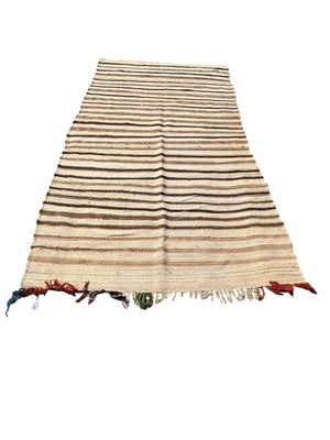 Lot 1321 - Mid-twentieth century striped Moroccan rug (140x300) together with two small Kelim runners (3)