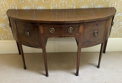 Lot 1351 - George III mahogany bowfront sideboard inlaid with vertical flutes and stringing, the central frieze drawer flanked by a deep drawer and a cupboard to each side, on square tapering legs, 190c...