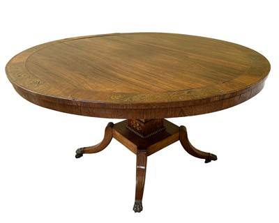 Lot 1544 - Regency rosewood brass inlaid breakfast table, the circular tilt-top crossbanded, on square plinth platform