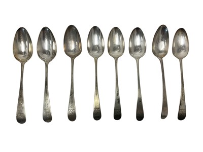 Lot 340 - Eight Georgian silver Old English pattern table spoons, with engraved armorial crests