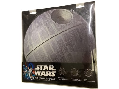 Lot 378 - Star Wars Death Star Worktop saver, metal worktop savers and selection of calendars (1 box)