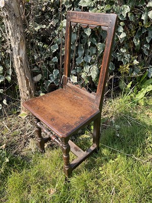 Lot 1451 - 17th century child's oak backstool, with turned and block understructure, 85cm high