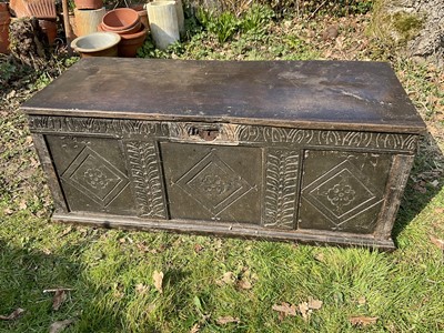 Lot 1455 - 18th century carved oak coffer, with hinged top and three lozenge carved panel front, 141cm wide x 41cm deep x 40cm high