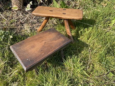 Lot 1458 - 19th century rustic elm milking stool and another milking stool. (2)