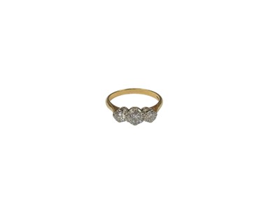 Lot 552 - Diamond three stone ring with three brilliant cut diamonds in claw setting on 18ct gold shank
