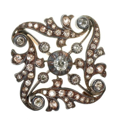 Lot 610 - Victorian diamond brooch, the openwork foliate scroll plaque set with old cut diamonds in a silver and gold setting