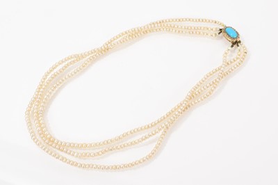 Lot 612 - Cultured pearl three-strand necklace with an antique oval gold turquoise and rose cut diamond clasp