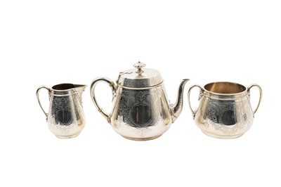 Lot 338 - Victorian silver three piece tea set, finely engraved floral decoration