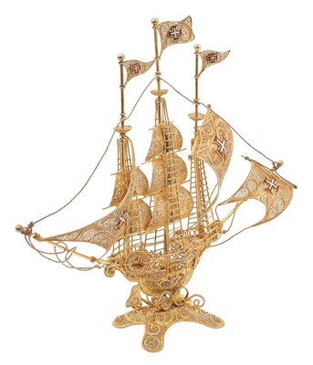 Lot 339 - Portuguese silver gilt filigree model galleon with enamel flags