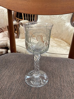 Lot 125 - Georgian-style wine glass with engraved and enamelled Jacobite portrait, mottos and foliage, with air twist stem, 18cm high