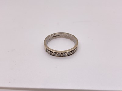 Lot 76 - 9ct white gold diamond half eternity ring