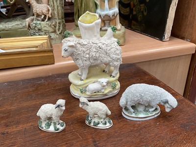 Lot 826 - A late Staffordshire sheep and lamb spill vase, and three small Continental porcelain sheep