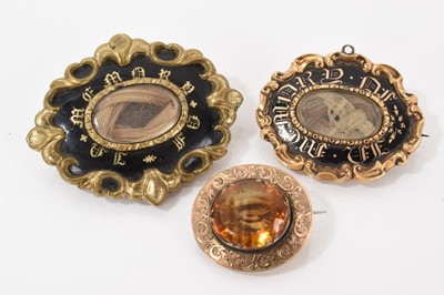 Lot 508 - Two early Victorian mourning brooches and a Victorian citrine/cairngorm brooch (3)