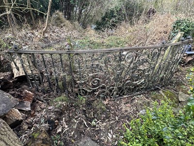 Lot 1497 - Victorian cast iron length of balustrade of slightly bowed form with scrolled and turned column decoration, approximately 300cm long