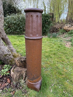 Lot 1498 - An unusually tall Victorian glazed chimney pot, on tapered square base, 135cm high