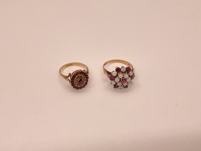 Lot 22 - Opal and ruby cluster ring in 9ct gold setting, London 1976, and a 9ct gold garnet cluster ring (2)