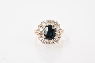 Lot 579 - Sapphire and diamond cluster ring