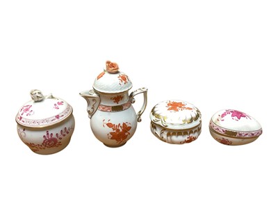 Lot 920 - Herend hand painted porcelain miniature hot water pot and cover, two Herend pots and covers and a Meissen pot and cover (4)