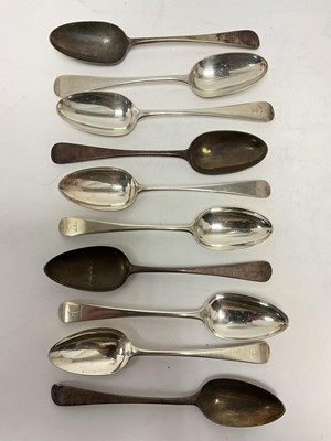 Lot 37 - Group of ten Georgian and Victorian silver Old English pattern tablespoons with matching crests, three with mottos
