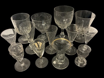 Lot 53 - Collection of 18th and 19th century drinking glasses, including a Georgian rummer engraved with a poem, a marriage goblet dated 1864, and two toasting glasses (13)