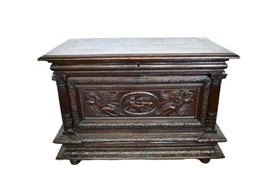 Lot 1368 - 17th century Continental carved oak cassone, the hinged top with moulded edge, enclosing interior with fitted locking strong box, the front relief carved in the Classical style with depiction of...