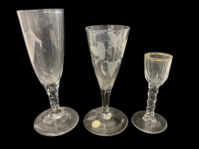 Lot 57 - Six Georgian drinking glasses, including two with teared stems and folded feet, one plain stem with drawn trumpet bowl, one etched with vines and wheat, an ale flute with faceted stem and a cord...