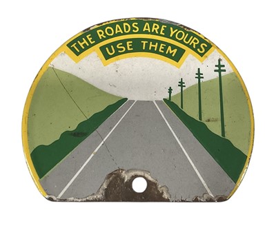 Lot 2 - Vintage enamel car sign / badge c. 1950's 'The roads are yours use them', 10.5cm in width.