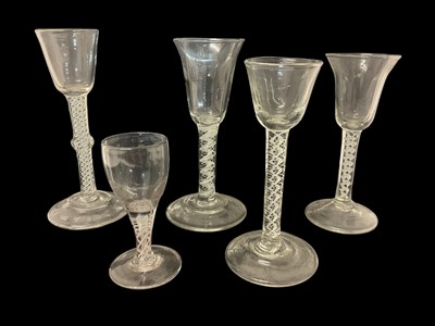 Lot 37 - Five 18th/19th century continental opaque twist wine glasses, 11cm to 18.75cm high