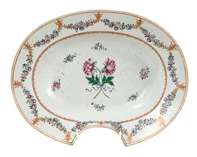 Lot 33 - 18th century Chinese famille rose export porcelain barber's bowl, painted with floral sprays and swags, 31cm wide