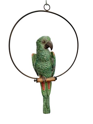 Lot 140 - Late 19th/early 20th century porcelain life-size green parrot, mounted on a brass swing