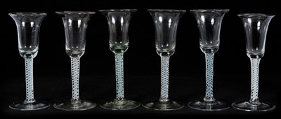 Lot 23 - Group of six wine glasses, Low Countries, circa 1760, with bell bowls on straight double series opaque twist stems, 16cm to 16.5cm high