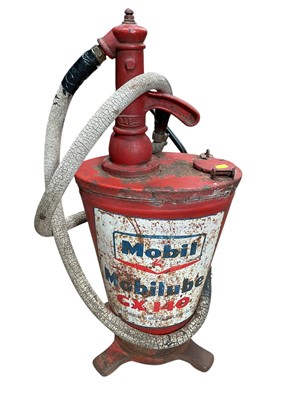 Lot 42 - Vintage red painted gear oil dispenser with Mobil branding.