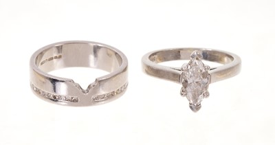 Lot 585 - Diamond single stone ring with a marquise cut diamond estimated to weigh 1.1ct in platinum claw setting, together with a platinum wedding band with princess cut diamonds (2)