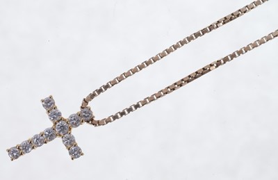 Lot 605 - Diamond cross pendant with eleven brilliant cut diamonds in 18ct gold setting on 9ct gold chain