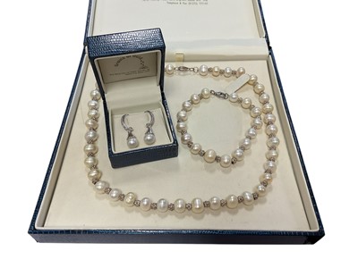Lot 221 - Pair of cultured pearl and diamond earrings in white gold setting, together with a freshwater cultured pearl and silver necklace and matching bracelet