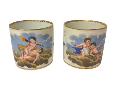 Lot 123 - Two early 19th century Vienna porcelain coffee cans, polychrome painted with putti