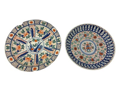 Lot 129 - 18th century Delft dish polychrome painted with panels of foliage, and a similar fluted Delft dish, 34cm and 30cm diameter (2)