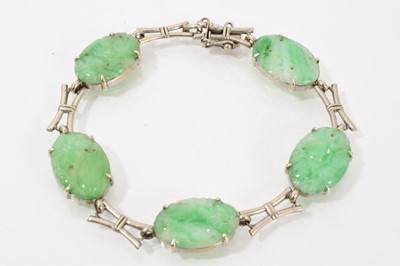 Lot 582 - Chinese carved green jade bracelet