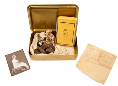 Lot 49 - First World War Princess Mary Gift Tin with original tobacco packet, Christmas card and photograph of Princess Mary. Together with pieces of shrapnel with annotation "HSB, bits of shell which bu...