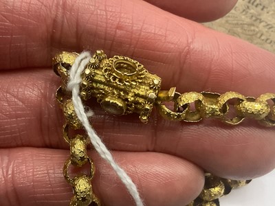 Lot 520 - Regency yellow metal chain with large belcher links decorated with stars, the barrel clasp with cannetille work decoration and oval mixed cut pink stones