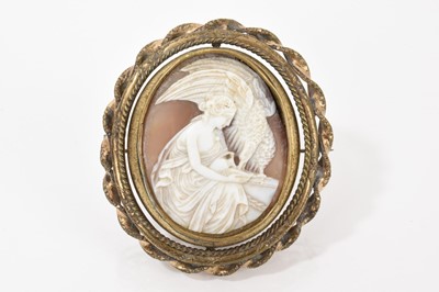 Lot 522 - 19th century Italian carved shell cameo depicting Hebe, Greek goddess of youth feeding an eagle, in a gilt metal revolving brooch mount with glazed portrait to the reverse
