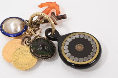 Lot 523 - Group of antique fobs on a gold split ring