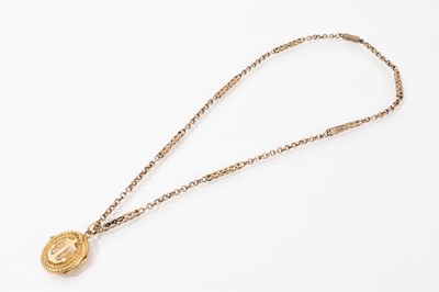 Lot 528 - Victorian gold oval locket with rope twist decoration and applied anchor, on yellow metal fancy link chain