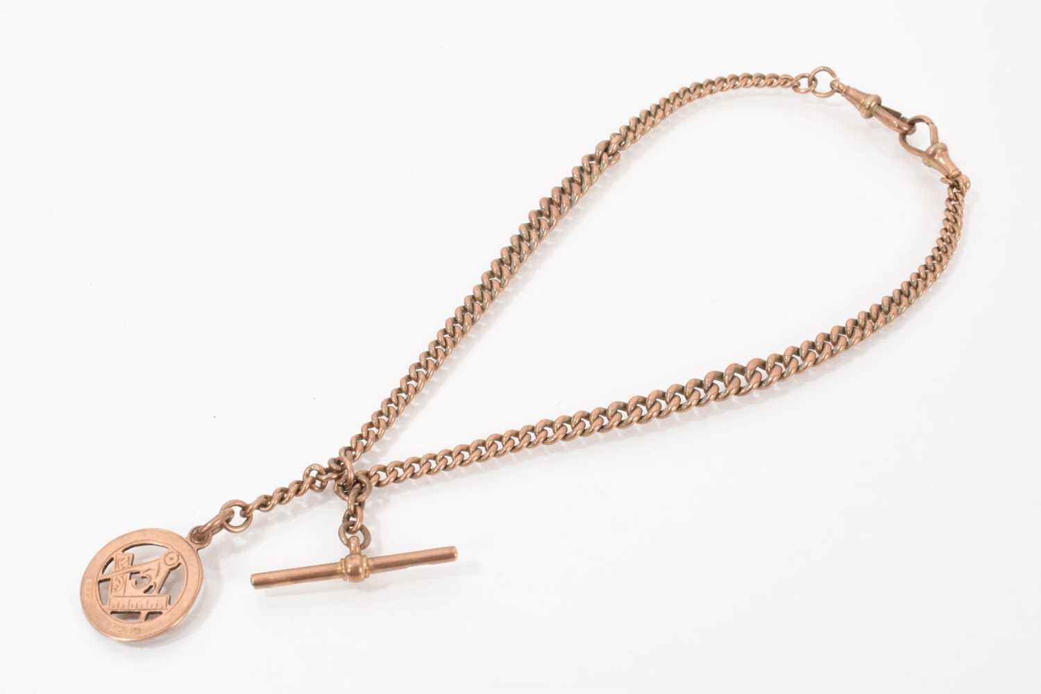 Lot 534 - Edwardian 9ct rose gold curb link watch chain with 9ct rose gold Masonic fob