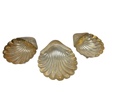 Lot 104 - Edwardian silver dish in the form of a shell, (Sheffield 1906), maker Atkin Brothers, together with a pair of Edward silver butter dishes of shell form