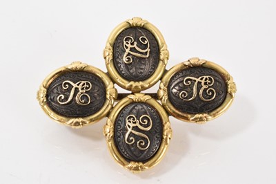 Lot 545 - Pair of 19th century gold and steel cufflinks later converted to a brooch, each oval plaque applied with gold initials on engraved steel ground, in yellow metal setting, 44mm x 35mm